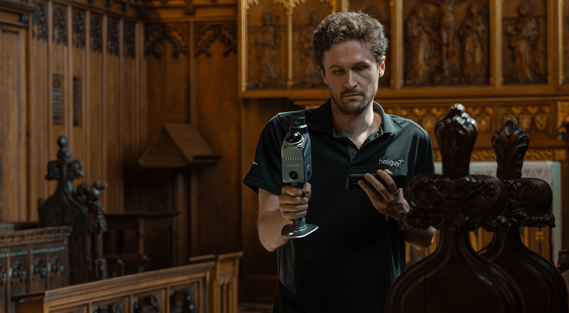 Operator 3D mapping a heritage interior with a handheld XGRIDS SLAM scanner